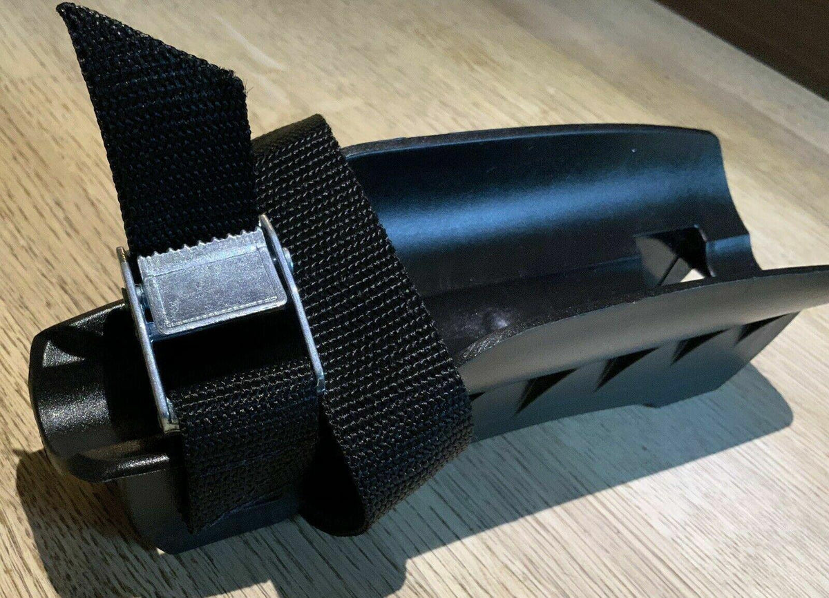 Black plastic clamp with nylon strap and metal buckle for securing equipment