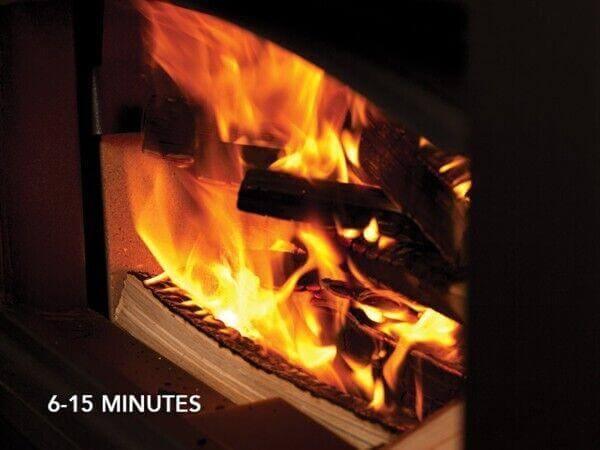 Warm fire burning in wood stove, cozy indoor setting
