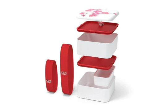 Red and white modular food containers with floral lid, stackable design for kitchen storage