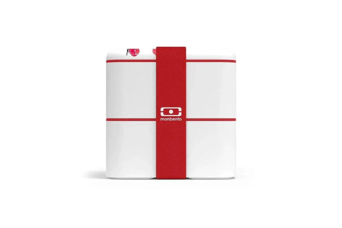 White Monbento bento box with red strap and logo, minimalist design for lunch storage