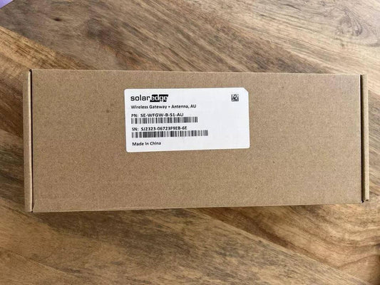 SolarEdge Wireless Gateway + Antenna AU box on wooden surface, product label visible
