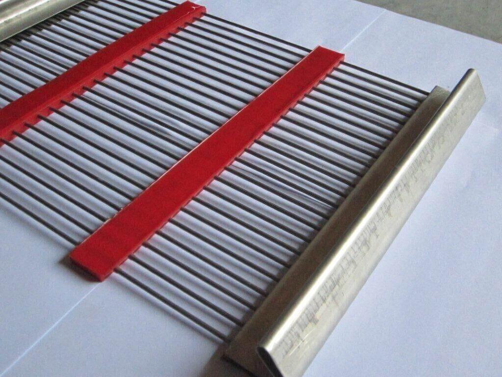 Metal grate with red plastic strips and stainless steel edge for industrial use