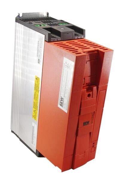 Red and silver SEW industrial motor drive with warning label and ventilation slots