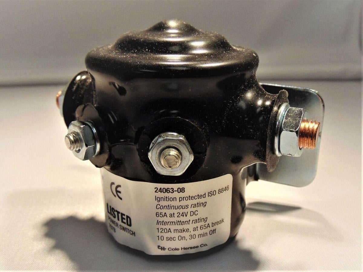 Black ignition-protected power switch with 65A 24V DC rating, ISO 8846 certified, for truck or tractor electrical systems