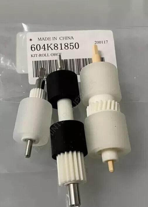 Plastic roller kit for office equipment, white and black components with metal shafts, labeled 604K81850