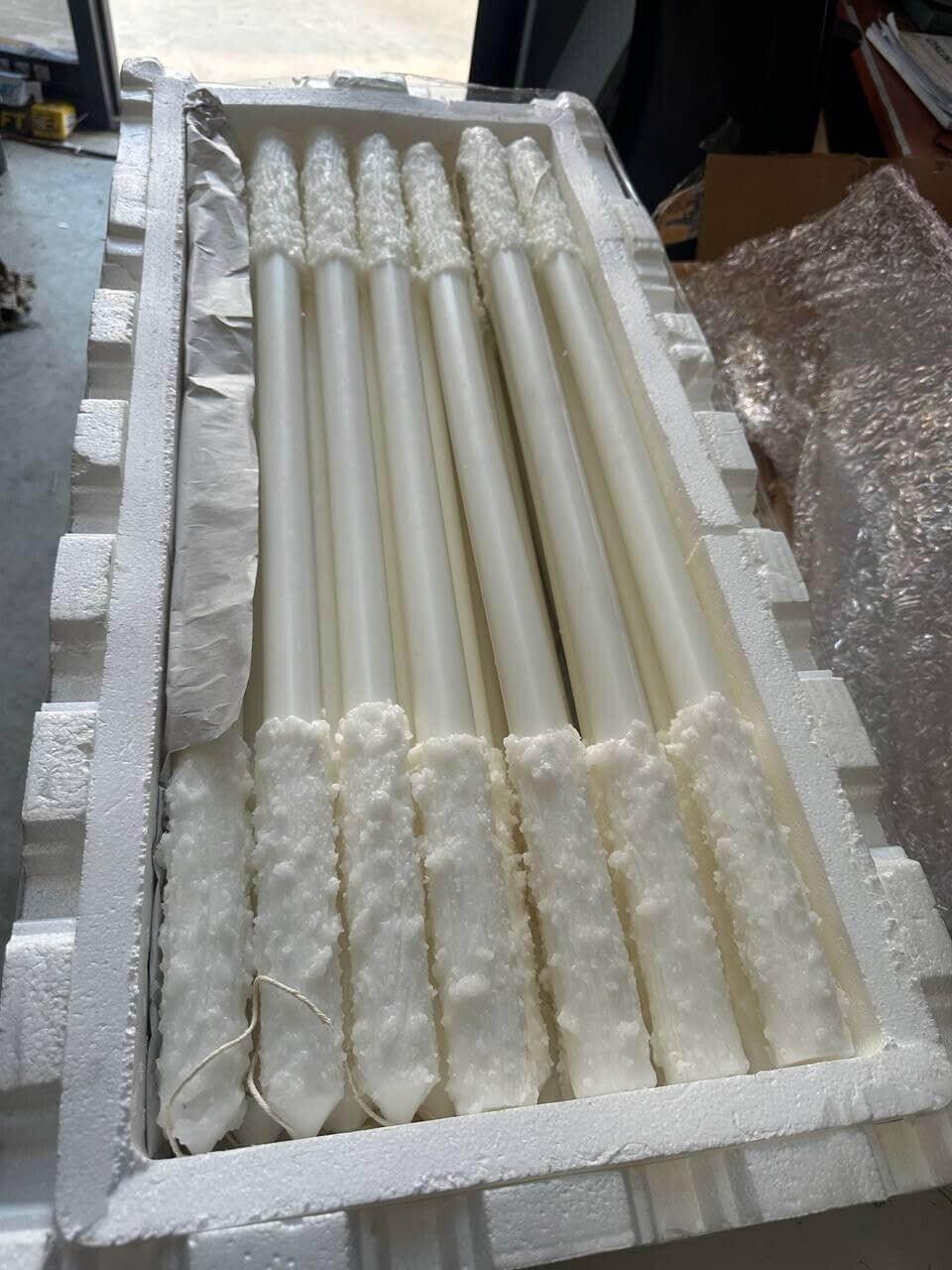 White textured candles in foam packaging for wholesale distribution