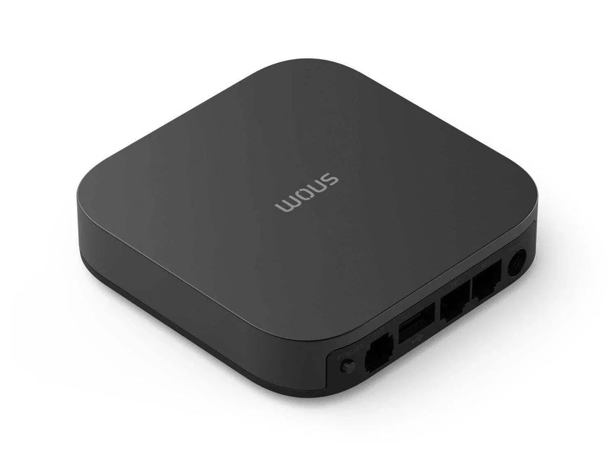 Black SNOM office phone system device with Ethernet ports and reset button