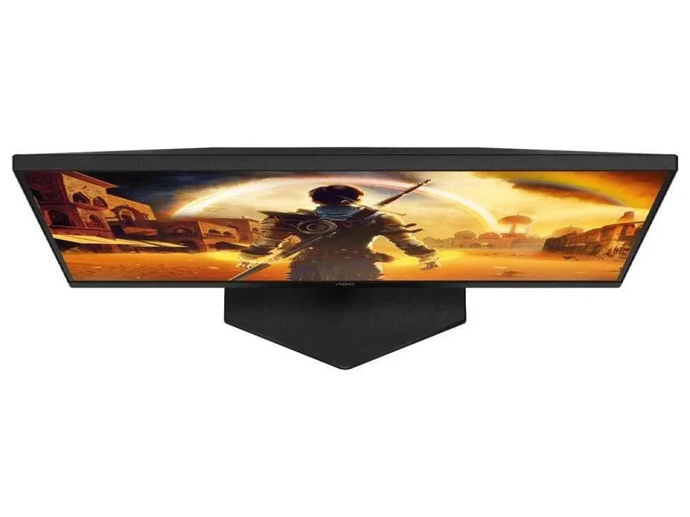 Wide curved gaming monitor displaying vibrant desert scene with warrior character