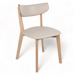Modern beige upholstered chair with wooden legs for office or home use