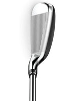 Shiny golf iron club head with grooved face and sleek metal shaft, isolated on white background