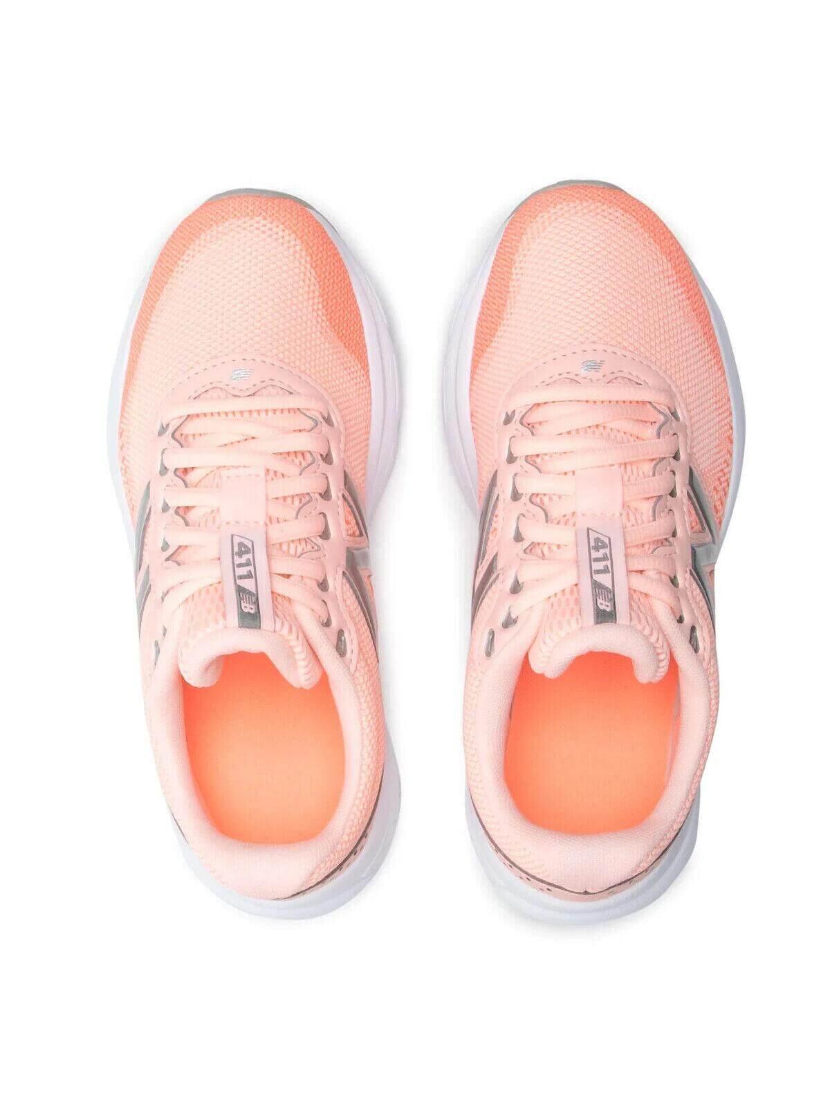 Pink New Balance 411 running shoes with breathable mesh and white soles