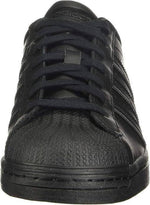 Black Adidas Superstar sneaker with textured toe cap and classic shell-toe design