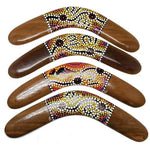 Hand-painted wooden boomerangs with Aboriginal dot art designs, colorful patterns, traditional Australian craftsmanship