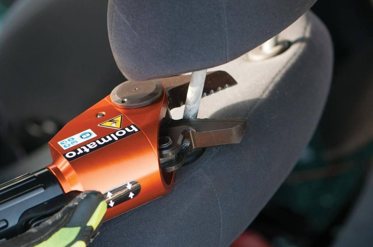 Holmatro rescue tool cutting car seat for emergency extraction
