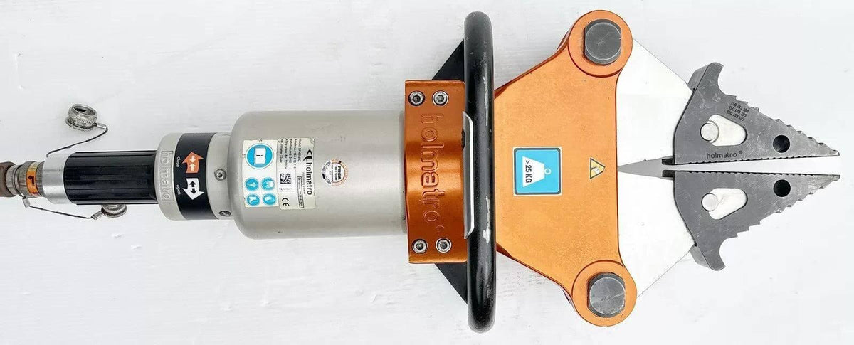 Holmatro hydraulic rescue tool with orange and silver design, featuring cutting blades and safety labels