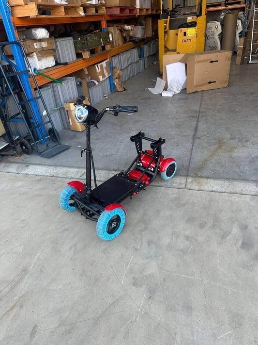 Red and black electric scooter with blue wheels in warehouse setting