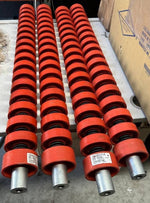 Red tractor suspension components with metal shafts, ideal for AGCO and EATON parts