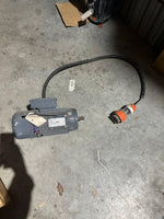 Industrial electric motor with orange plug, suitable for tractor parts and machinery use.