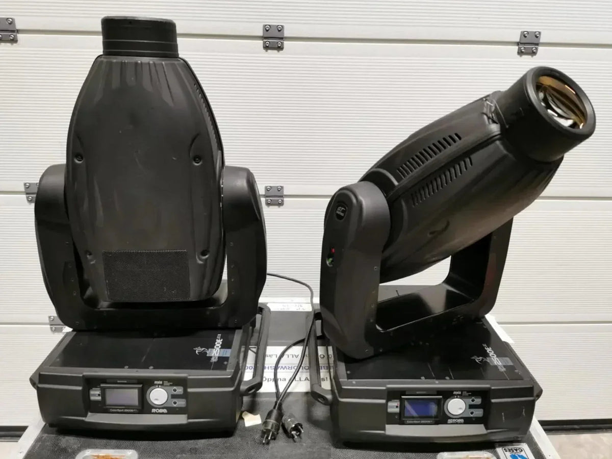 Professional stage lighting fixtures with adjustable heads and control panels for event setups