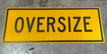 Yellow oversize warning sign for trucks and heavy equipment transport