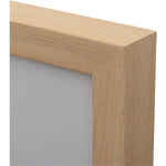 Light oak wood frame corner with smooth finish and natural grain texture