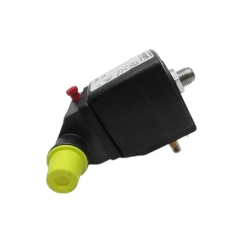 Black industrial pressure switch with yellow cap and red button, for tractor or truck parts systems