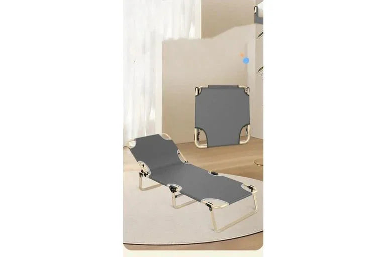 Grey foldable lounge chair with metal frame, ideal for outdoor relaxation or patio use.