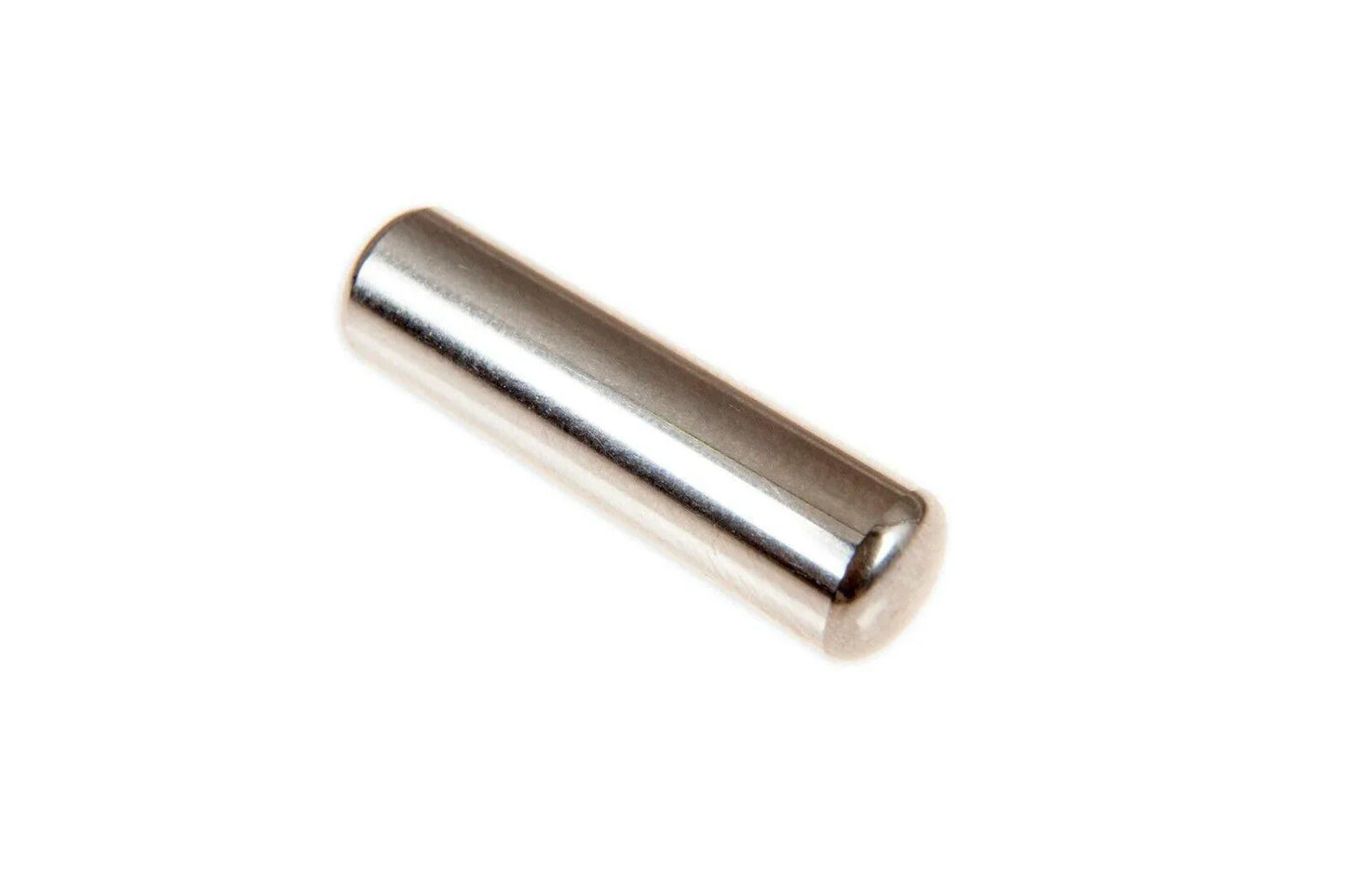 Closeup of a cylindrical steel needle bearing for tractor parts on a white background