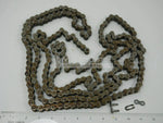Steel diamond chain with connector links for tractor, displayed on white background with ruler
