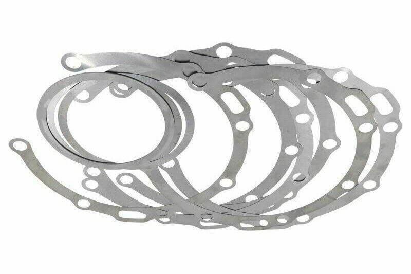 Steel axle hardware shim pack for truck and tractor parts, multiple rings stacked