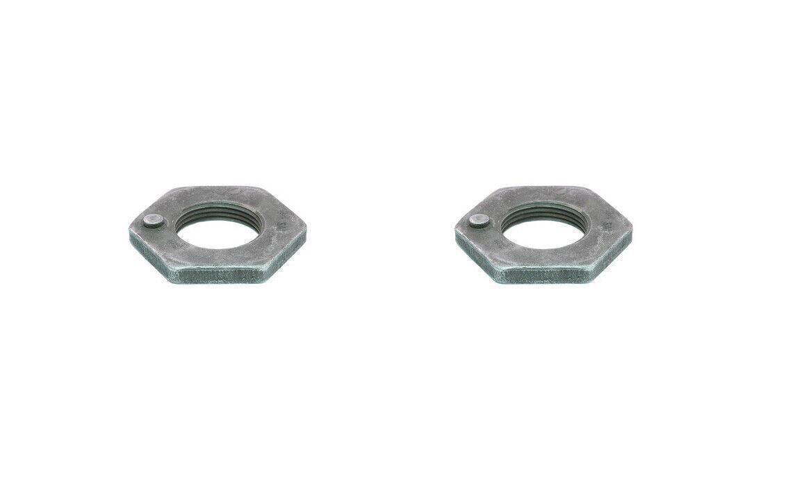 Pair of hexagonal inner nuts for truck axle parts on white background