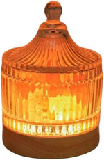 Amber glass candle holder with ribbed design and warm glow, rustic decor accent
