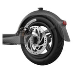 Electric scooter rear wheel with disc brake, tire, and fender detail