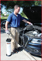 Man using fluid extractor on car engine, auto maintenance tool