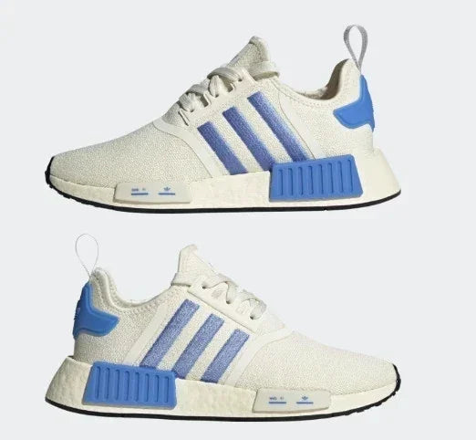 White and blue athletic sneakers with striped design and cushioned sole