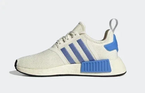White sneaker with blue stripes and heel detail, stylish casual footwear