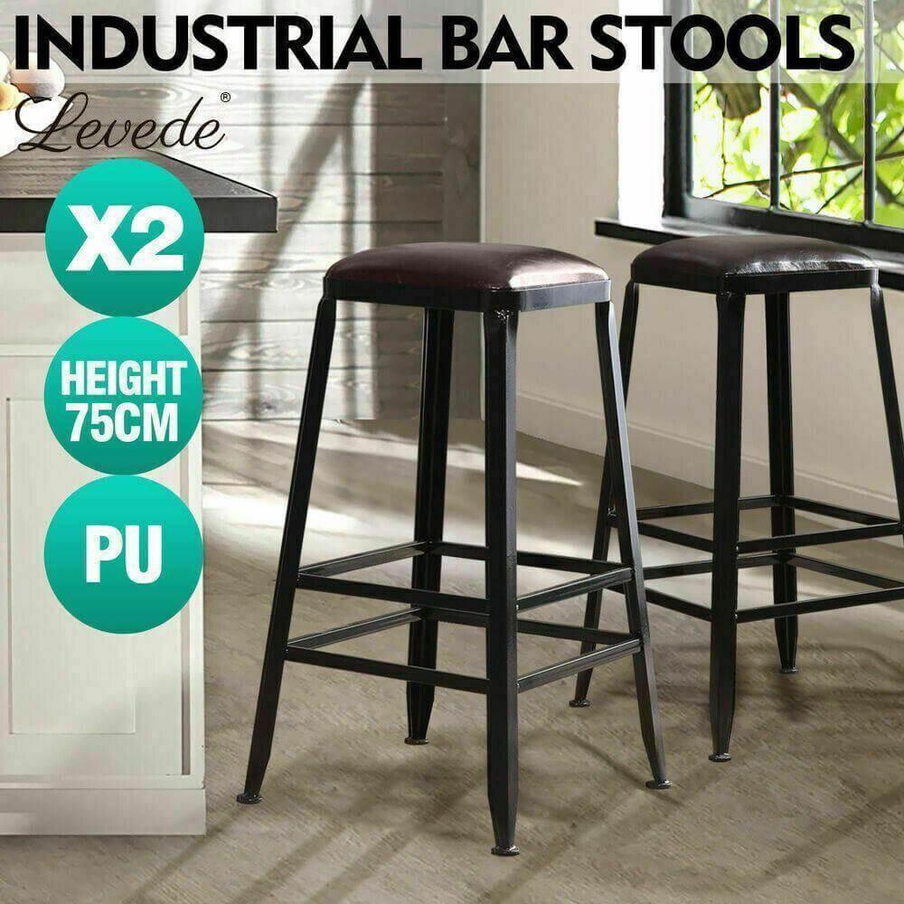 Set of two industrial bar stools with black metal frames and cushioned PU leather seats, 75cm high.