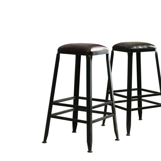 Pair of industrial bar stools with black metal legs and brown leather seats