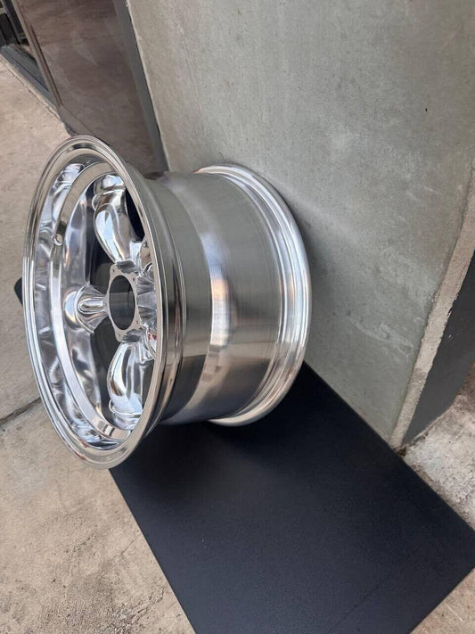 Shiny chrome alloy wheel with five-spoke design, ideal for trucks or heavy-duty vehicles