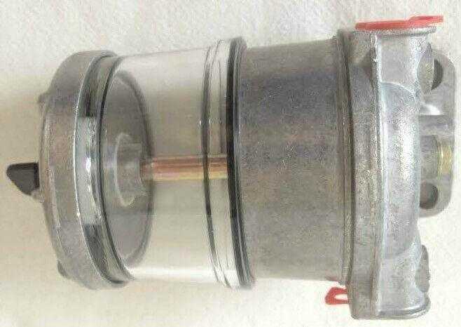 Tractor pre-filter kit with clear plastic housing and metal fittings, shown on white background