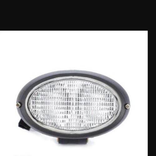 Oval tractor worklight with clear lens and black housing, spare part for agricultural vehicles