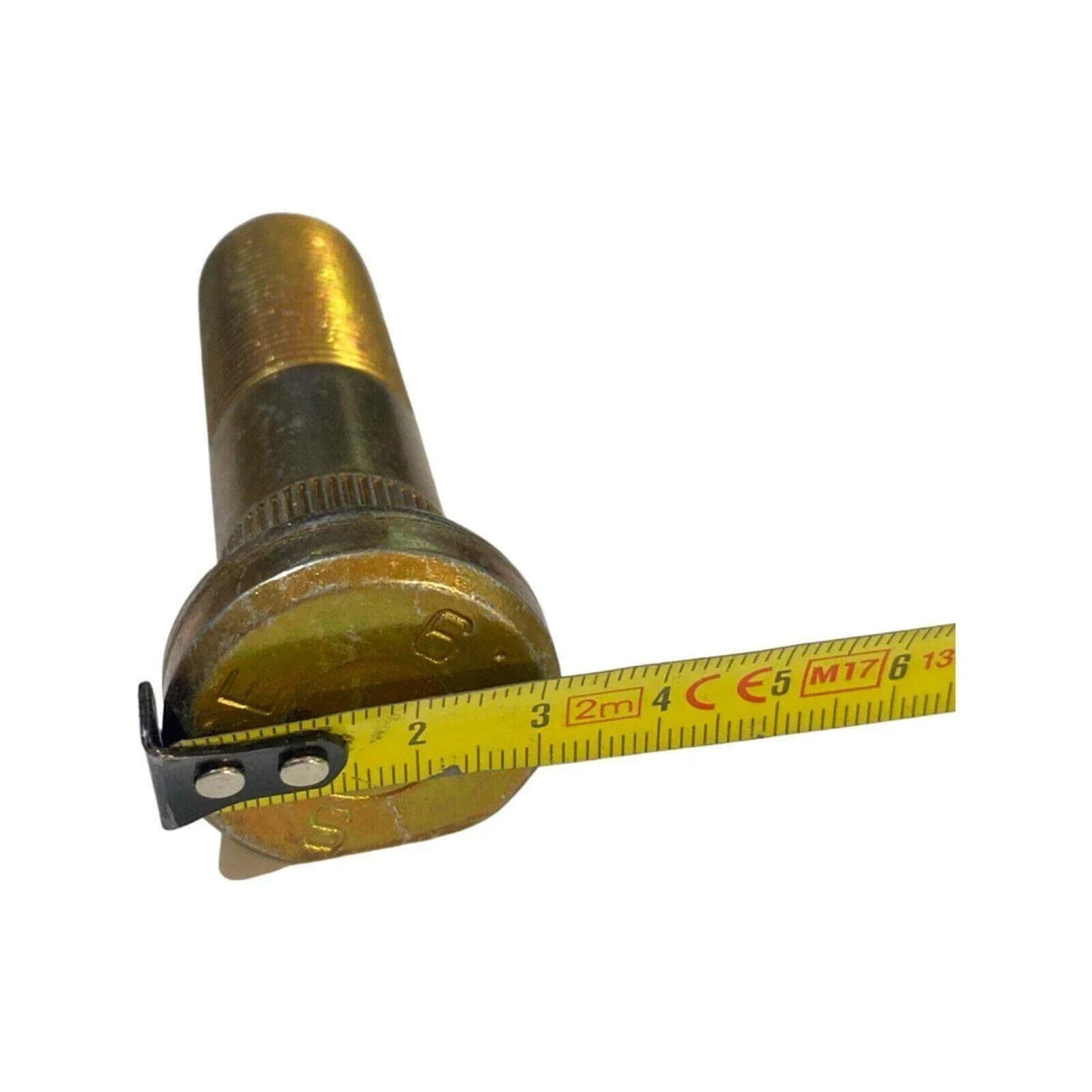 Threaded metal tractor stud bolt measured with yellow tape measure on white background