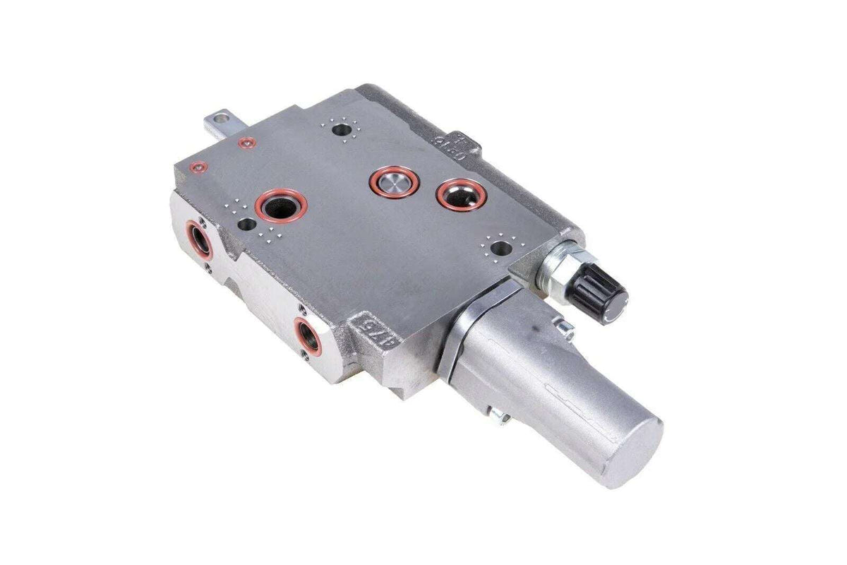 Metal tractor distributor valve part with multiple ports, isolated on white background