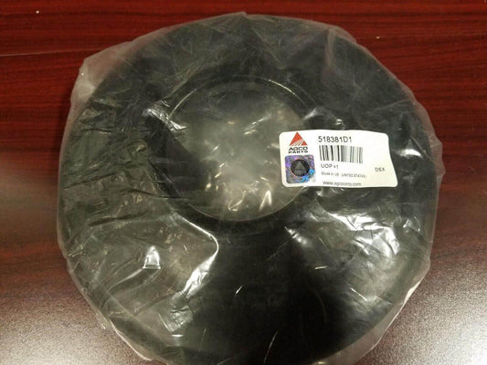 Black oil seal for tractor, part number 518381D1, sealed in plastic packaging on wood surface