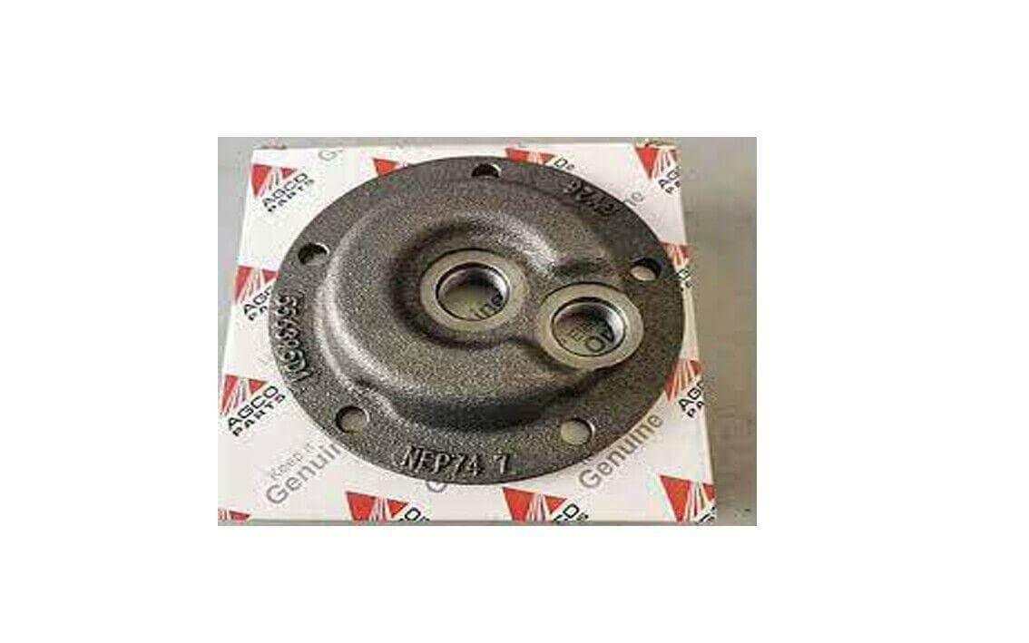 Round metal cab hub mid roller part with bolt holes for tractor machinery on branded box