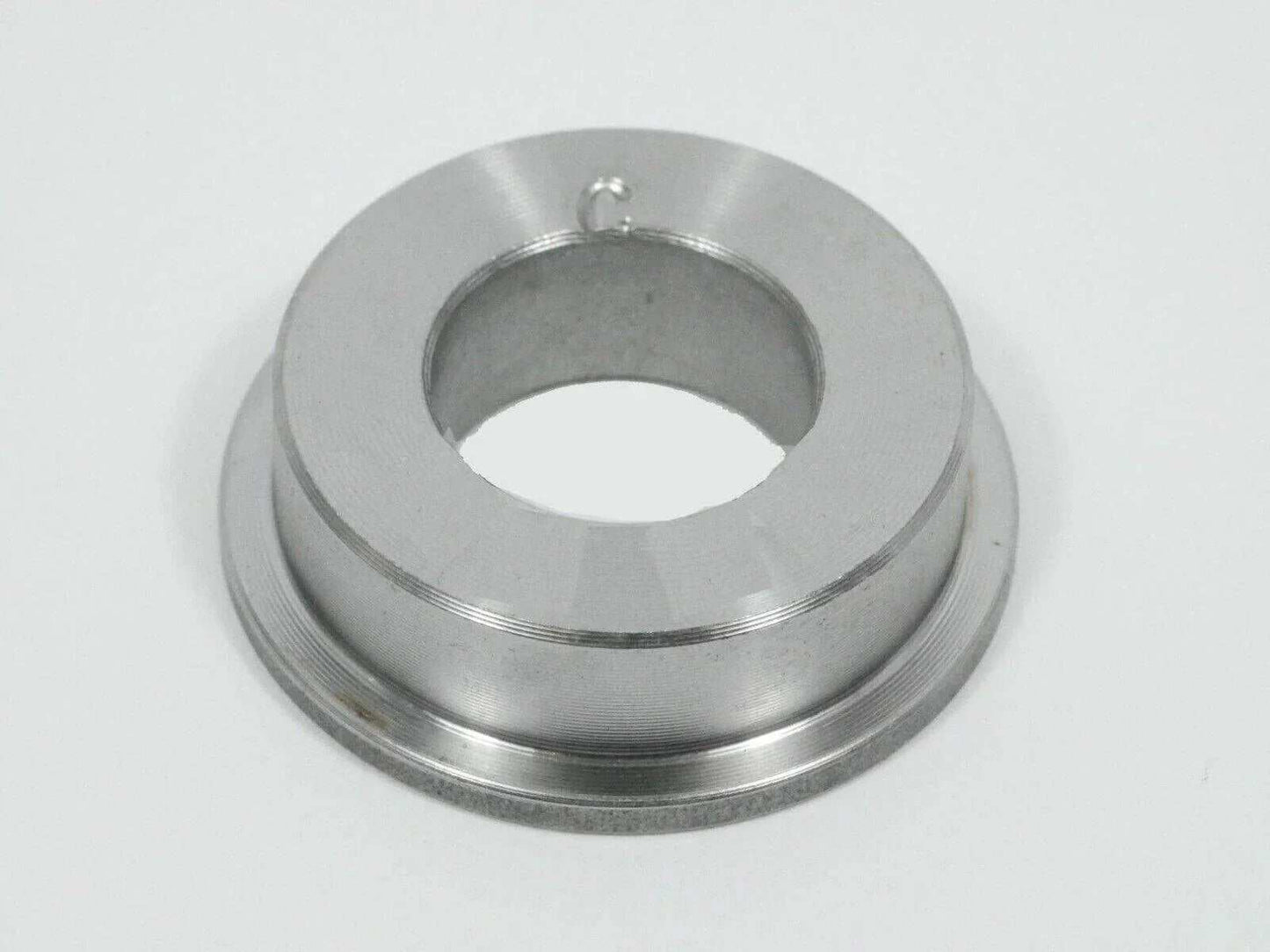 Metal bearing bushing for tractor, close-up on white background, replacement part