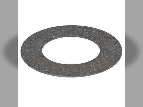 Round friction clutch disc for tractor, flat grey metal ring on plain background