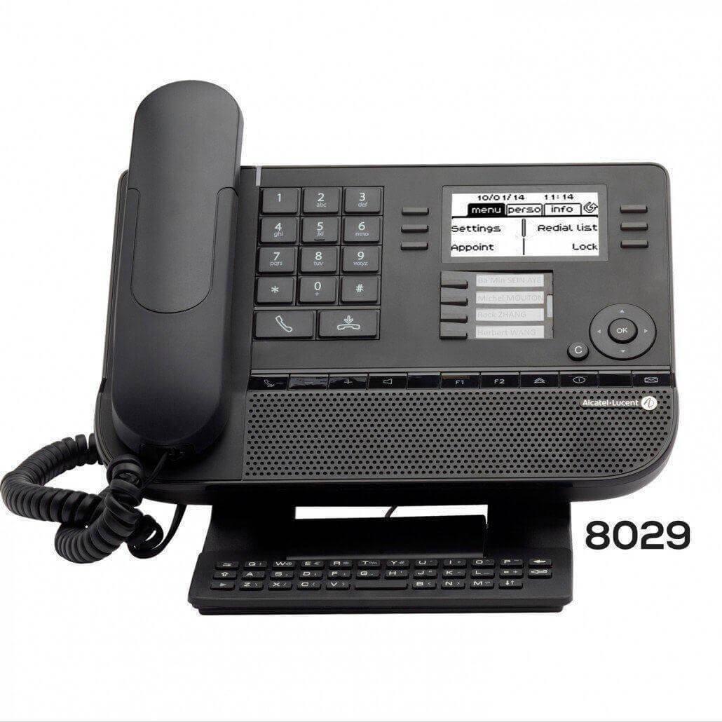 Black digital office desk phone with display screen, keypad, function buttons, and corded handset