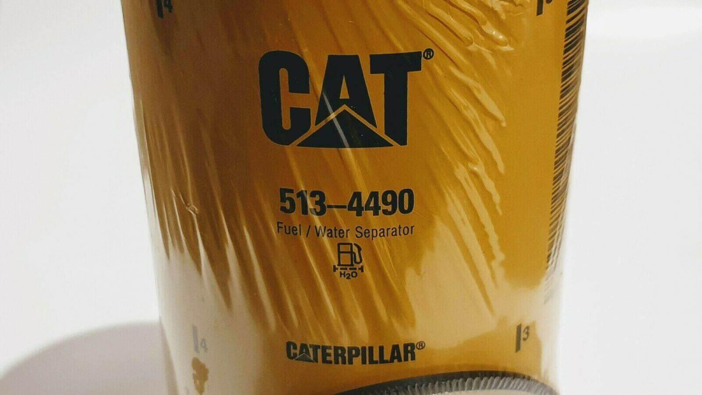CAT 513-4490 yellow fuel water separator filter with Caterpillar logo, close-up view
