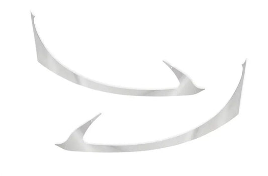 Pair of chrome headlight trim accents for International Prostar truck model on white background